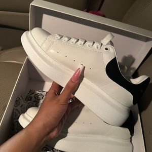 White and Black Tennis Shoe Gold Detail